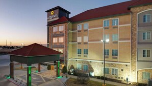 A multi-story hotel with a prominent sign reading "La Quinta".