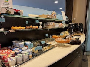 Enjoy a delicious breakfast spread with a variety of pastries, bread, and dairy products.