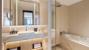 Une salle de bain moderne avec un grand miroir, deux lavabos, une douche et un espace de douche clos par des parois de verre.