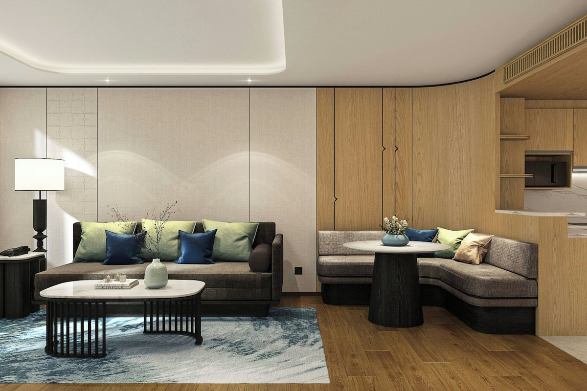 Premium Suite, 1 Bedroom | Living room | 55-inch LED TV with cable channels, TV, DVD player