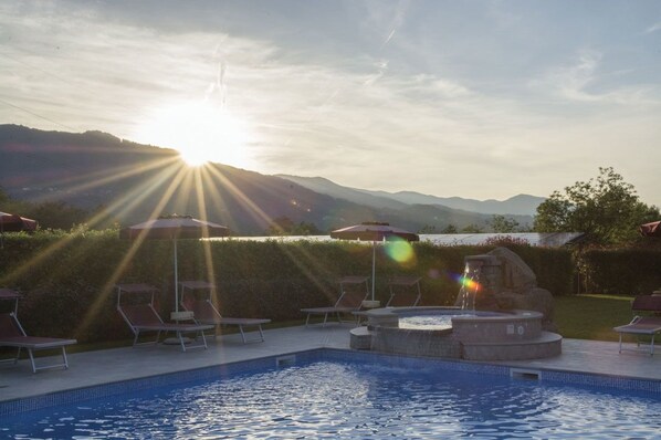 Outdoor pool, open 8:30 AM to 8:00 PM, pool umbrellas, pool loungers