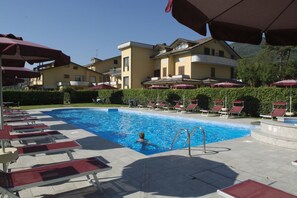 Outdoor pool, open 8:30 AM to 8:00 PM, pool umbrellas, pool loungers