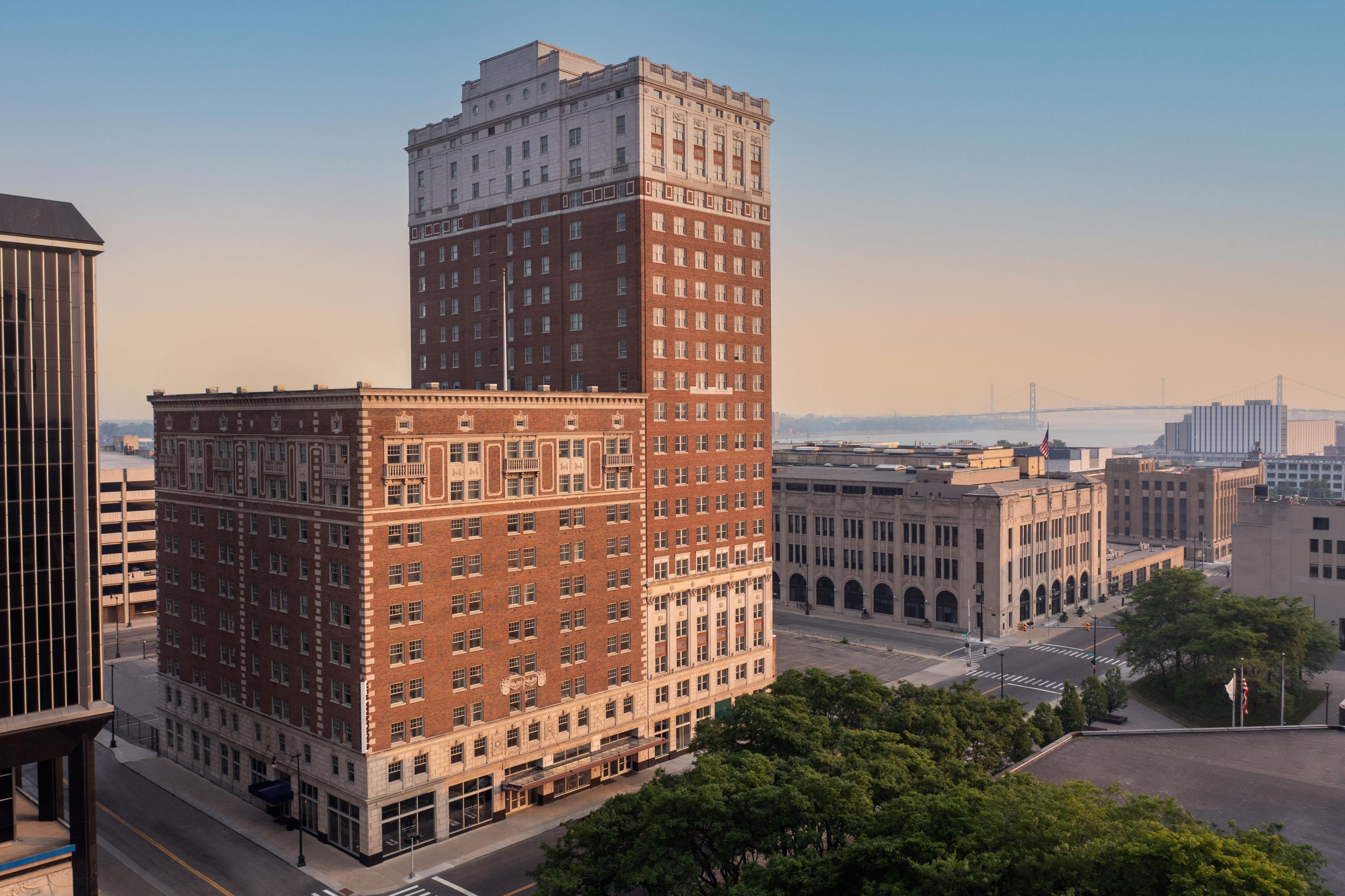 A multi-story building with a prominent corner section and a flat roof.