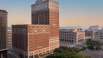 A multi-story building with a prominent corner section and a flat roof.