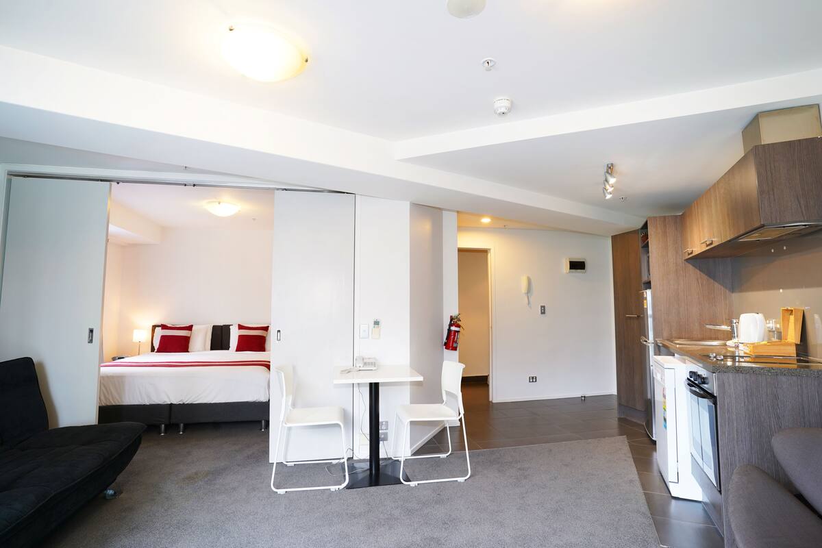 One Bedroom Superior Apartment | Living area | Flat-screen TV