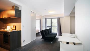 One Bedroom Budget Apartment | Living area | Flat-screen TV