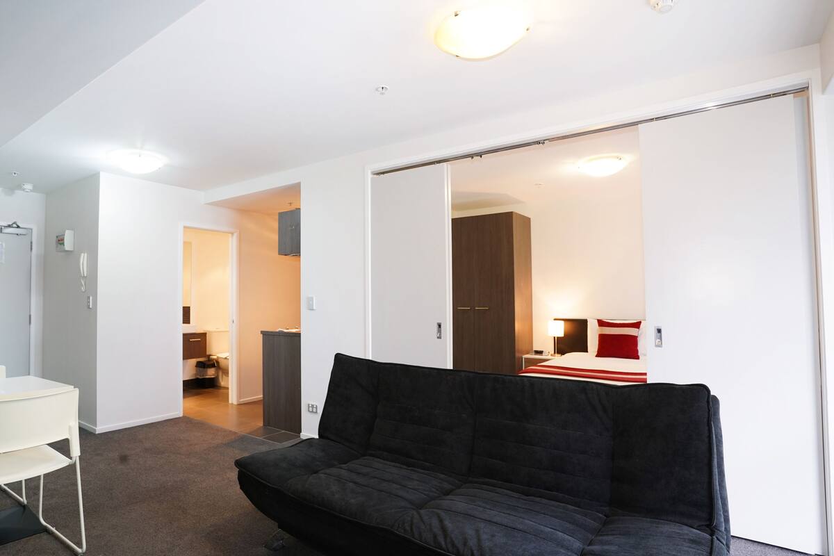 One Bedroom Budget Apartment | Living area | Flat-screen TV