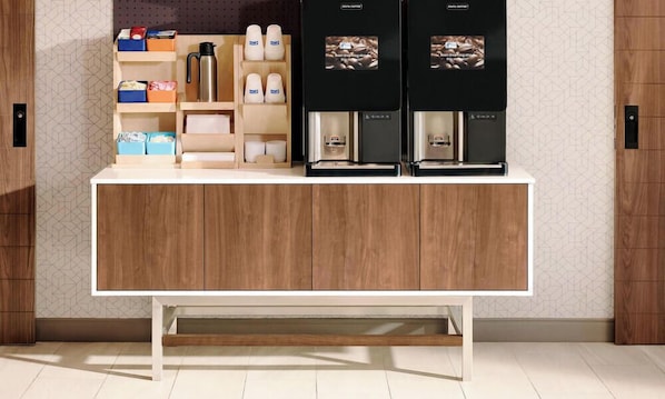 A modern kitchen with a wooden countertop, two coffee machines, and a variety of kitchen items. - Holiday Inn Express & Suites Napa American Canyon by IHG (American Canyon)