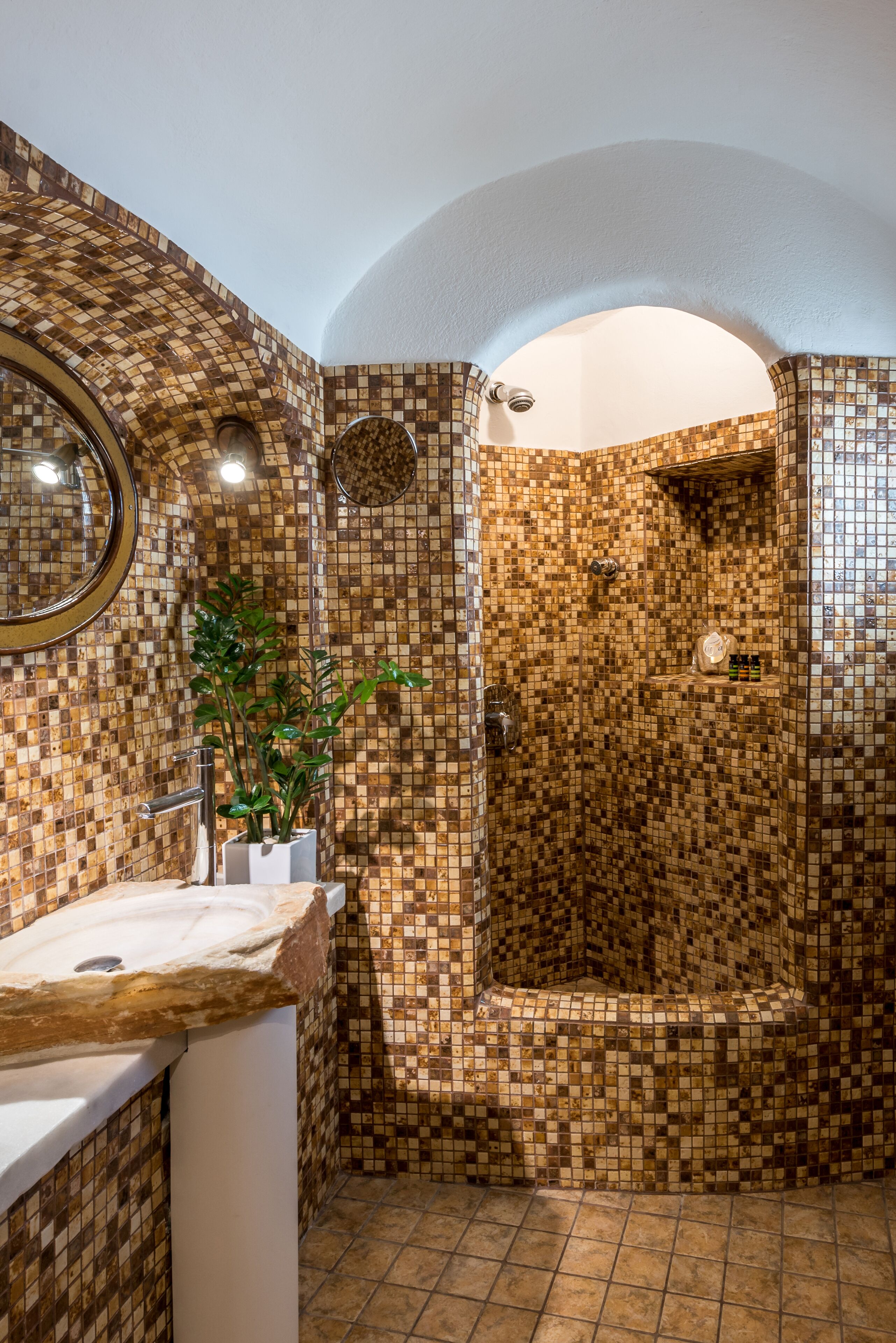 honeymoon suite (caldera view, indoor cave whirlpool) | bathroom | shower, rainfall showerhead, free toiletries, hair dryer