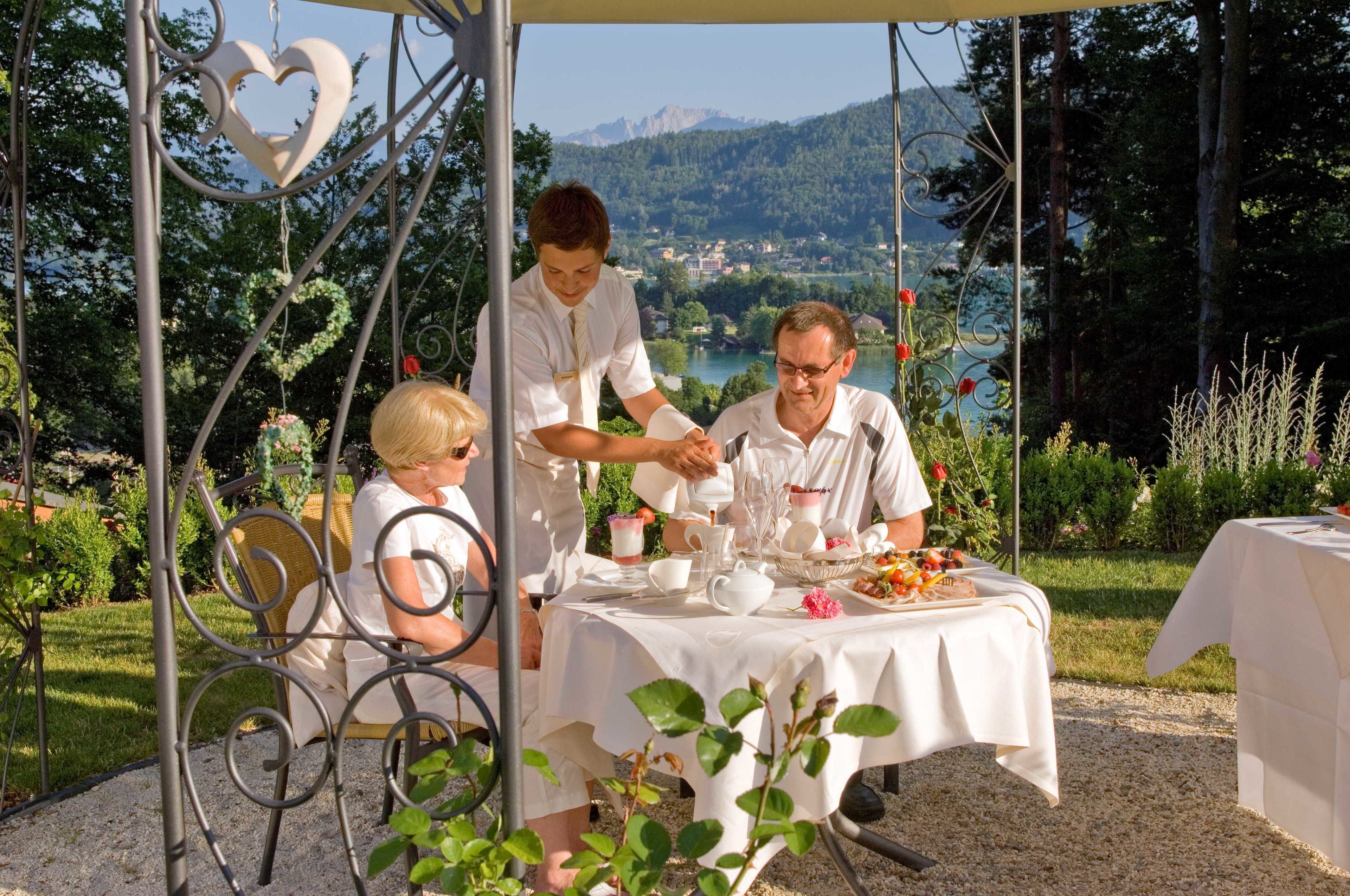 A table set outdoors with a scenic view in the background.