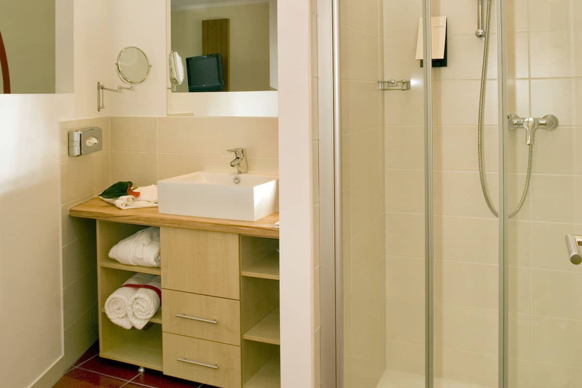 shower, designer toiletries, hair dryer, bathrobes