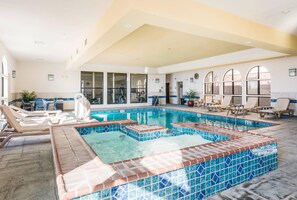 An indoor swimming pool with lounge chairs and a hot tub area. - Comfort Suites Fort Stockton (Fort Stockton)