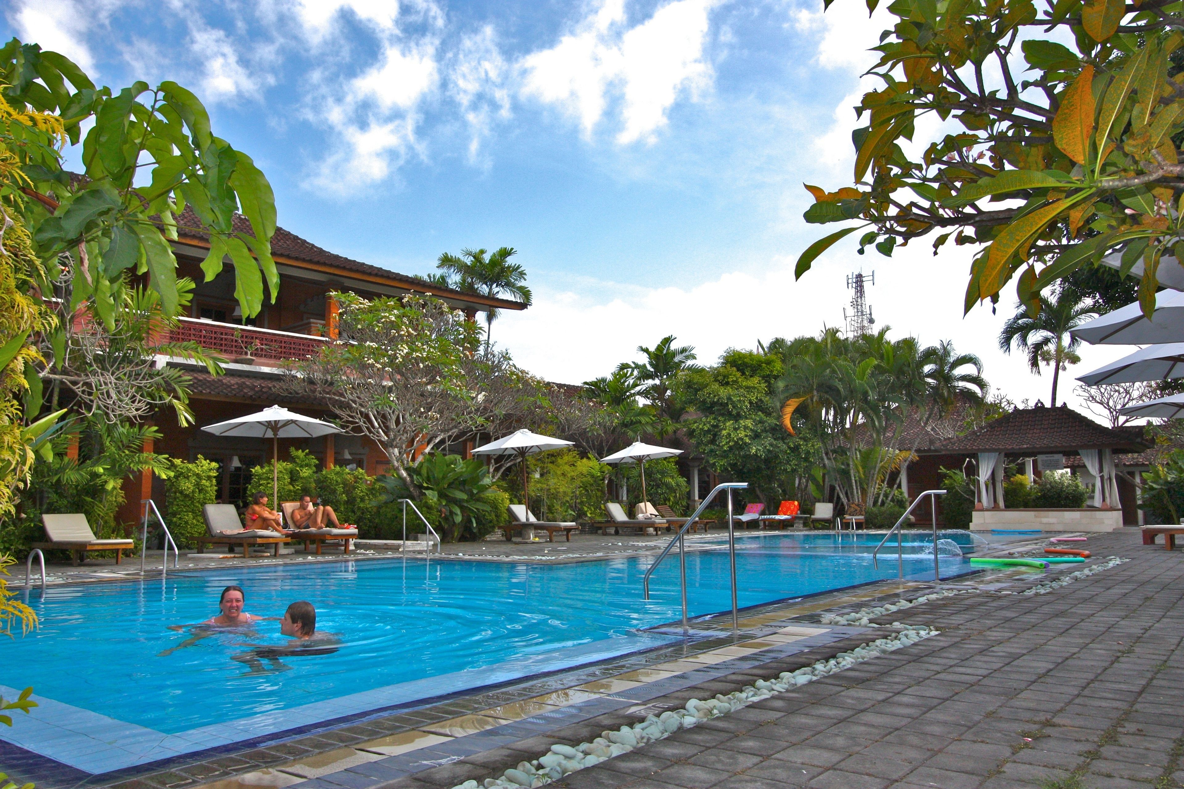 outdoor pool, open 6:00 am to 7:00 pm, pool umbrellas, pool loungers