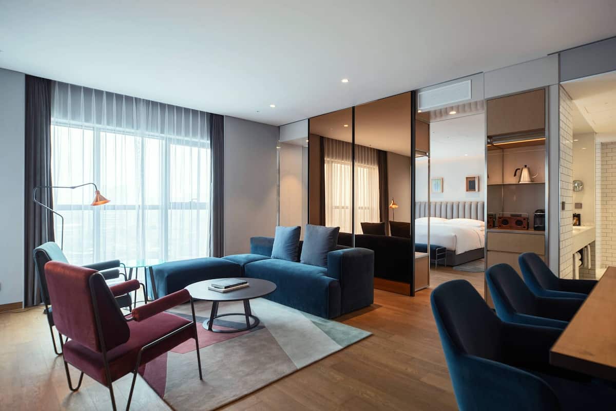 Artist Suite, 1 Bedroom, Non Smoking, City View | Living room | 49-inch LED TV with cable channels, TV