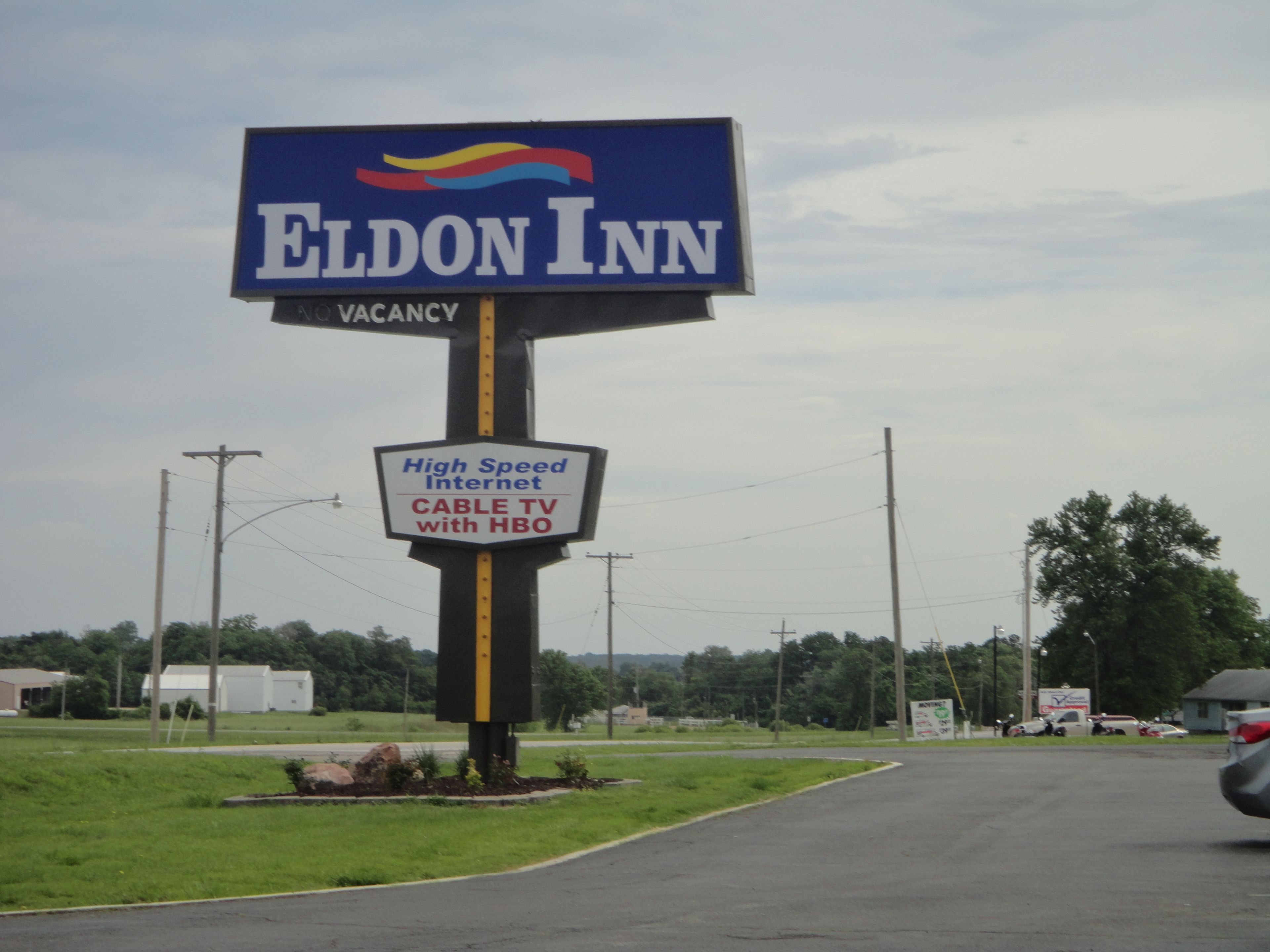 A sign for Eldon Inn advertising high-speed internet, cable TV, and HBO.