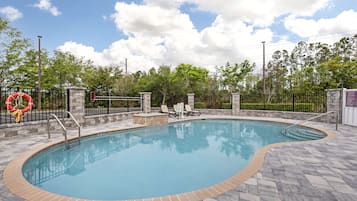 Outdoor pool, open 7:00 AM to 10:00 PM, pool umbrellas, sun loungers