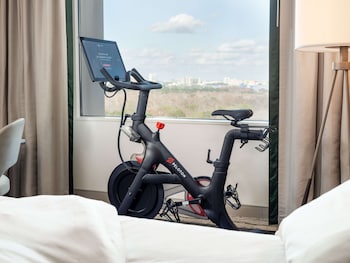 Room, 1 King Bed (Peloton Wellness Room) | Premium bedding, in-room safe, desk, blackout drapes at Signia by Hilton Orlando - An Official Walt Disney World® Hotel
