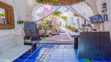 Classic Room, 2 Double Beds | Living area | 40-inch flat-screen TV with cable channels, TV, DVD player