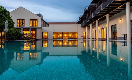 Indoor pool, outdoor pool, pool loungers. Tisza Balneum Thermal Hotel