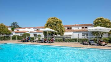 Seasonal outdoor pool, pool umbrellas, pool loungers