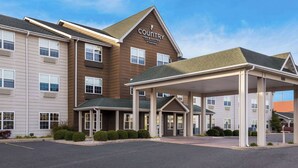 A Country Inn & Suites building with a covered entrance and a parking lot. - Country Inn & Suites by Radisson, Marion, IL (Marion)