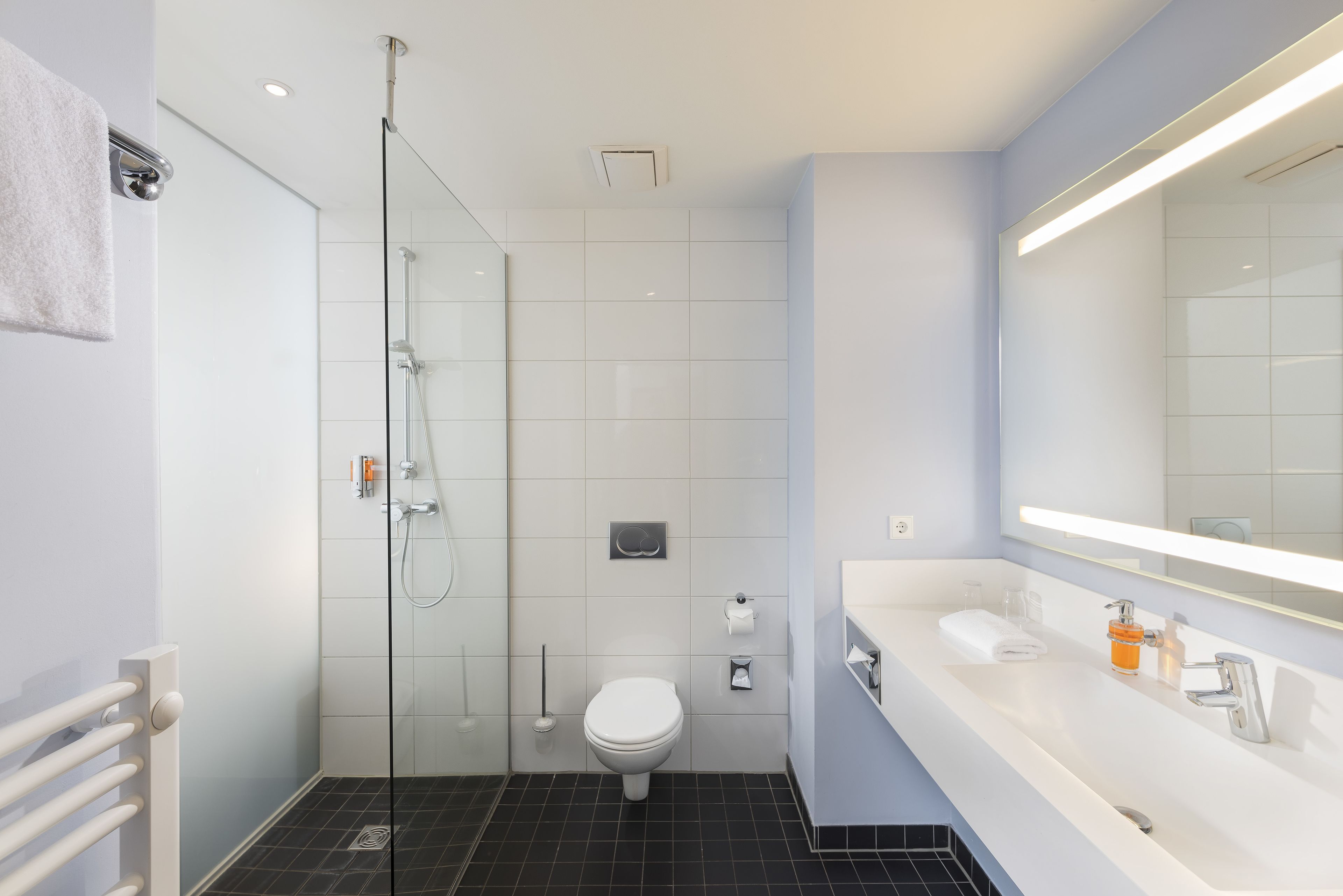 eco-friendly toiletries, hair dryer, towels