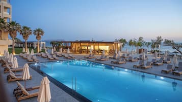 Seasonal outdoor pool, pool umbrellas, pool loungers