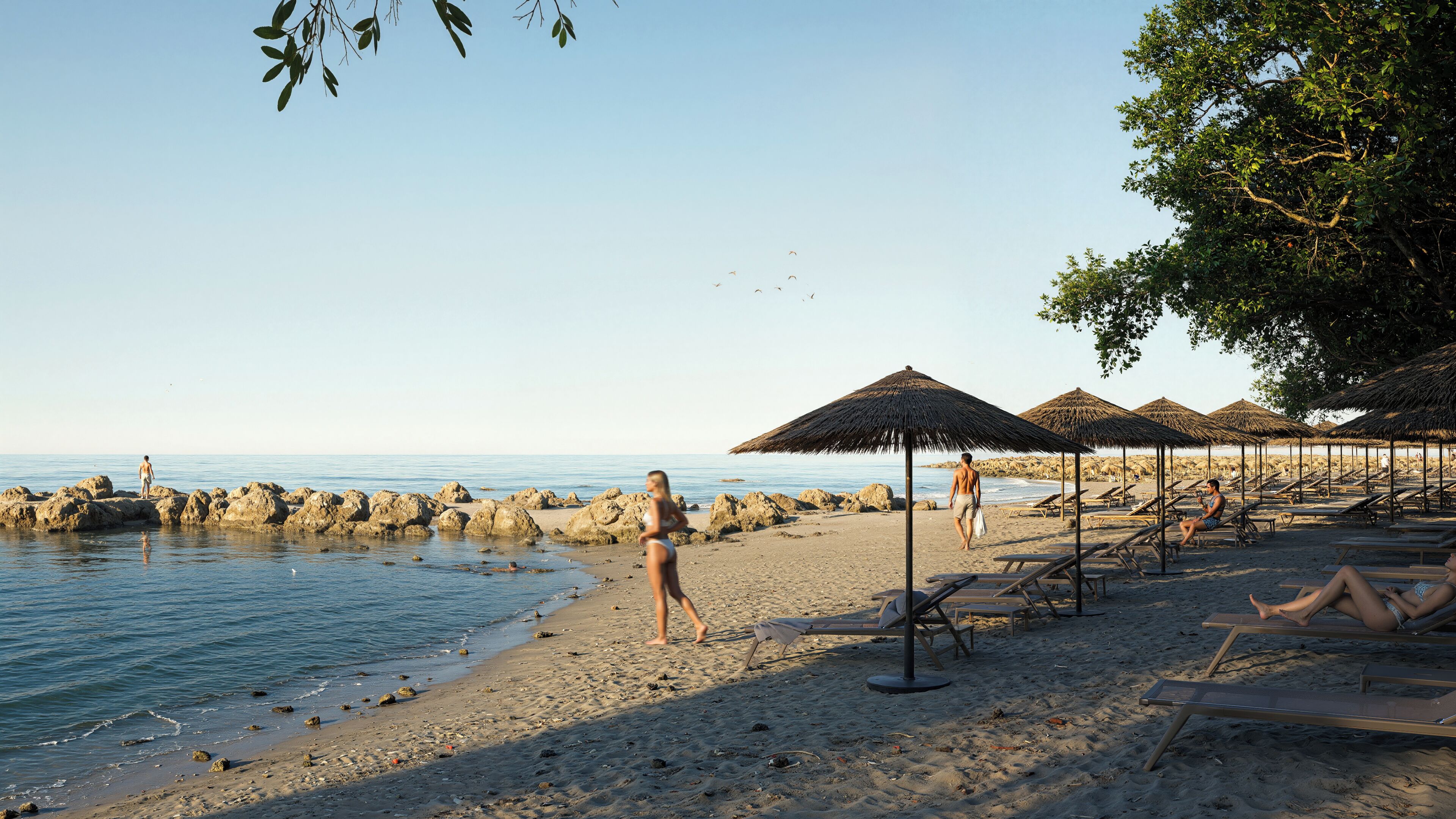 Una spiaggia nelle vicinanze, lettini da mare, ombrelloni