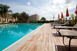 Seasonal outdoor pool, open 10:00 AM to 6:00 PM, pool loungers