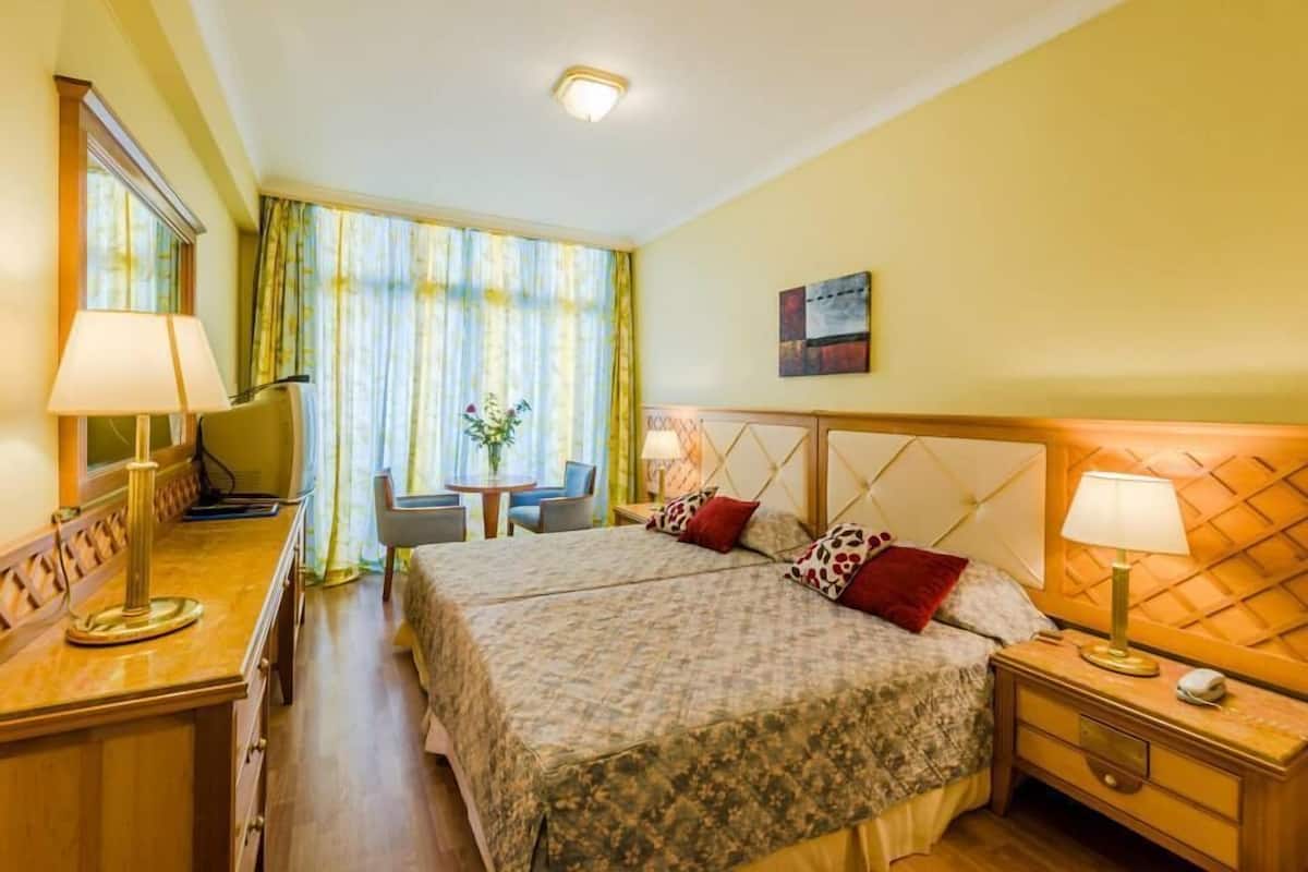 Desk, iron/ironing board (on request), WiFi (surcharge), bed sheets
