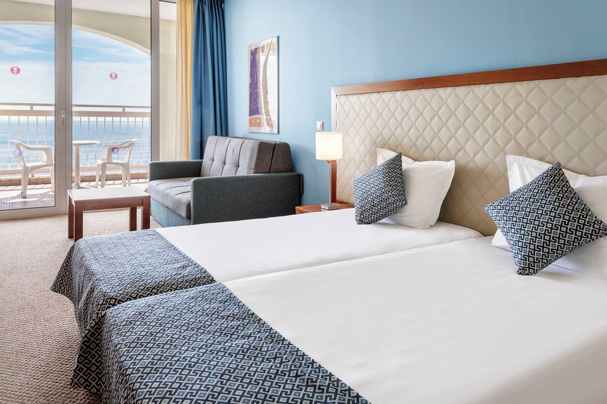 standard room, multiple beds, sea view | minibar, desk, blackout curtains, free cots/infant beds