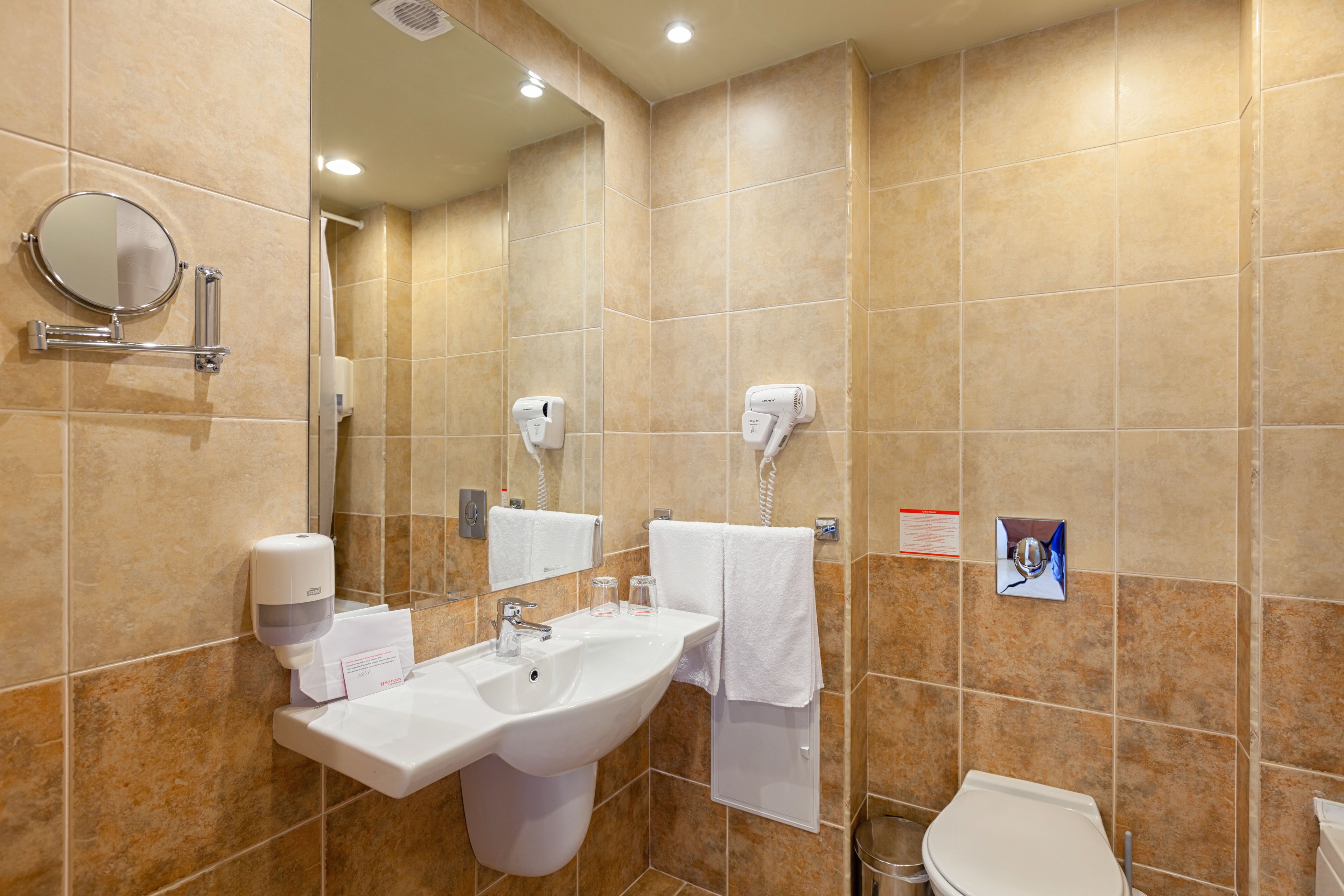 rainfall showerhead, eco-friendly toiletries, hair dryer, towels