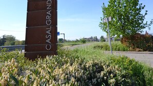 A tall, rectangular sign with the text "HOTEL CASAL GRANDE" indicating the name of the establishment.