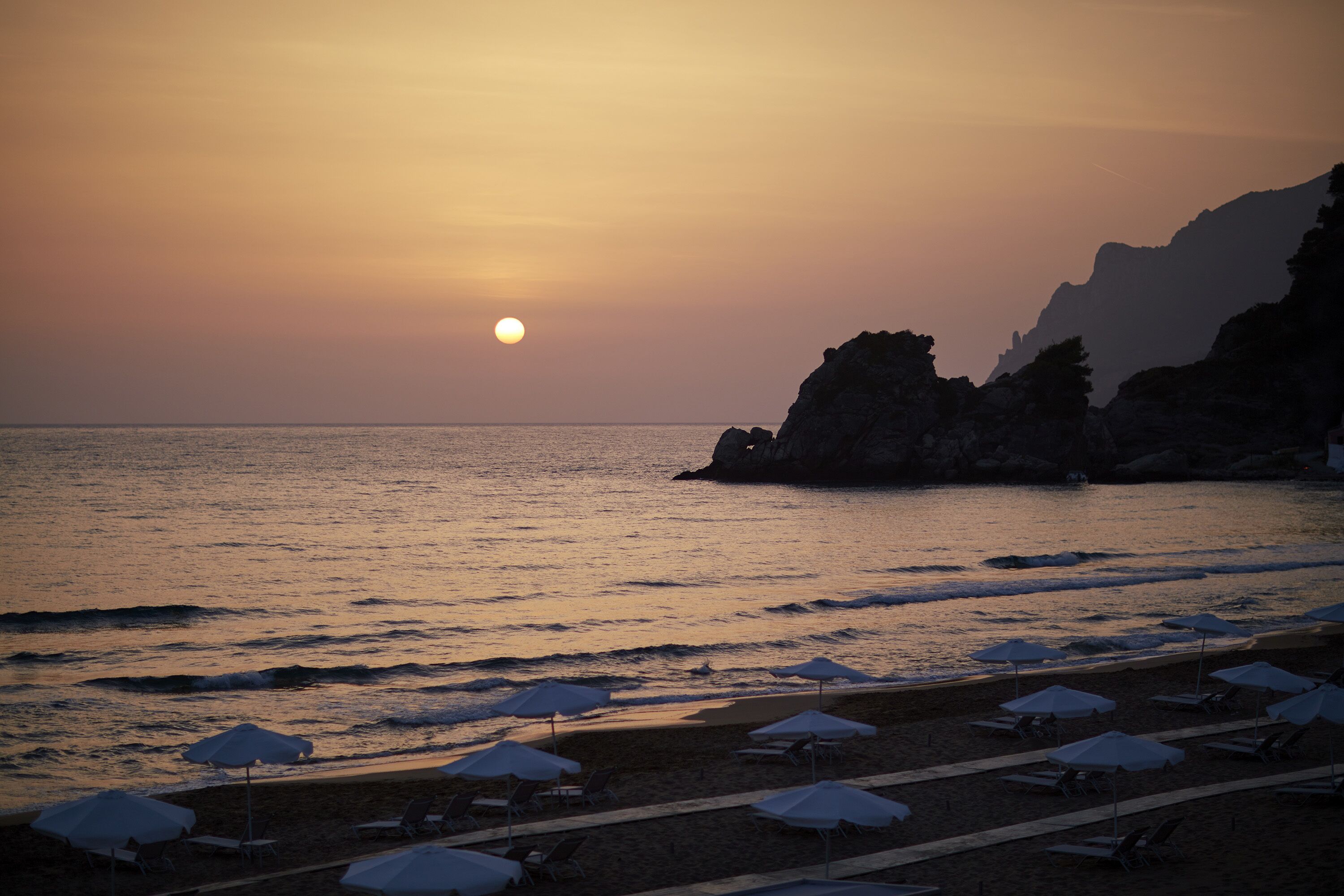on the beach, sun-loungers, beach umbrellas, beach towels