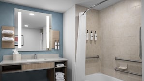 A modern bathroom with a shower, a sink, and a vanity. - Hilton Garden Inn Chesapeake/Suffolk (Suffolk)