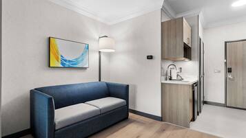 Suite, 1 King Bed | Desk, blackout curtains, iron/ironing board, cots/infant beds