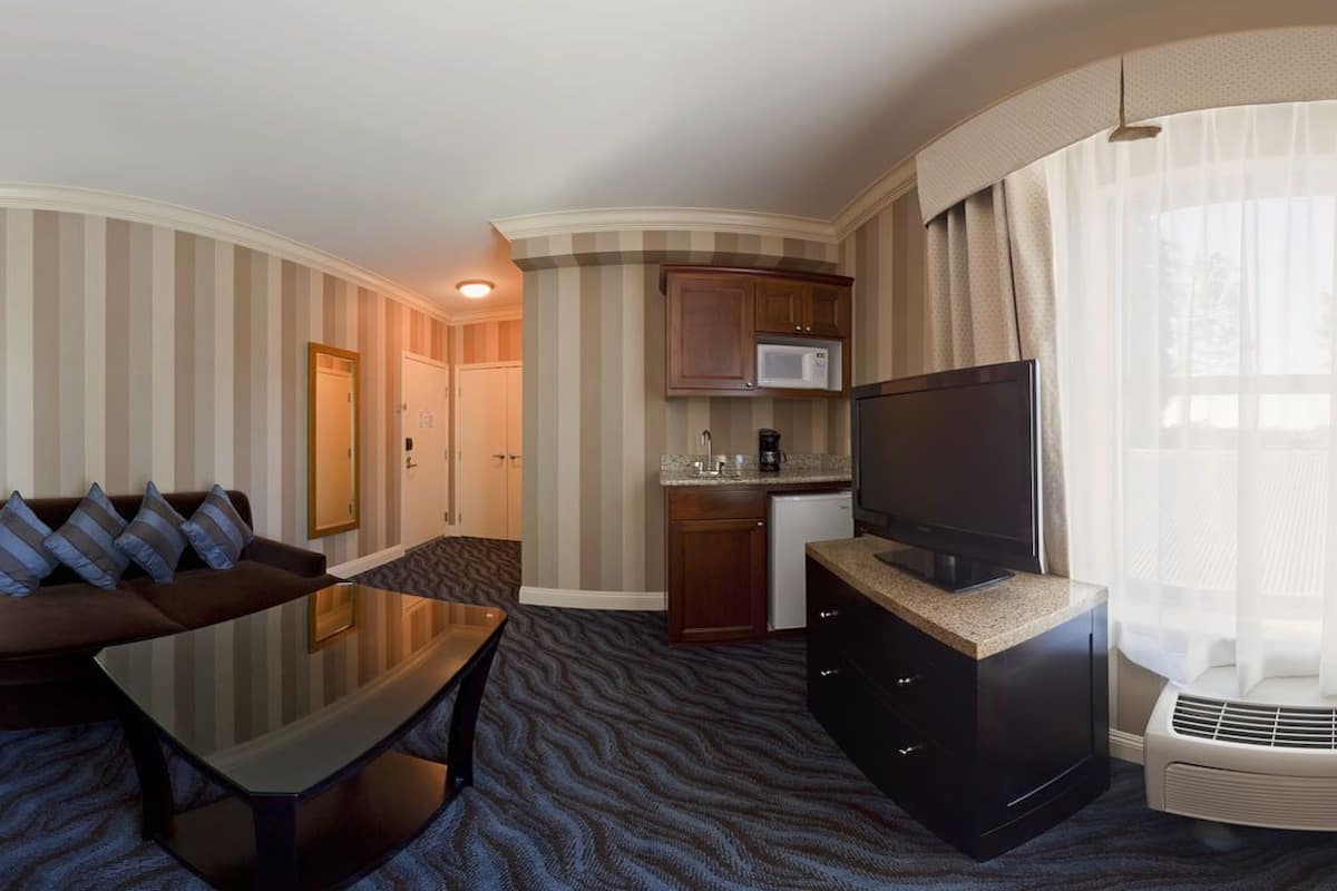 suite, 2 queen beds | living area | lcd tv