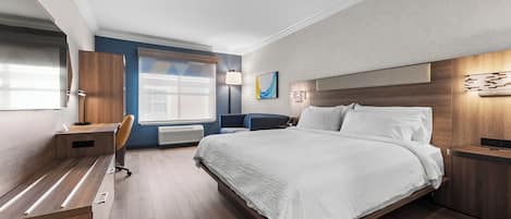 Escritorio, cortinas blackout, tabla de planchar con plancha y cunas