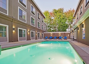 Seasonal outdoor pool, open 7:00 AM to 10:00 PM, pool loungers