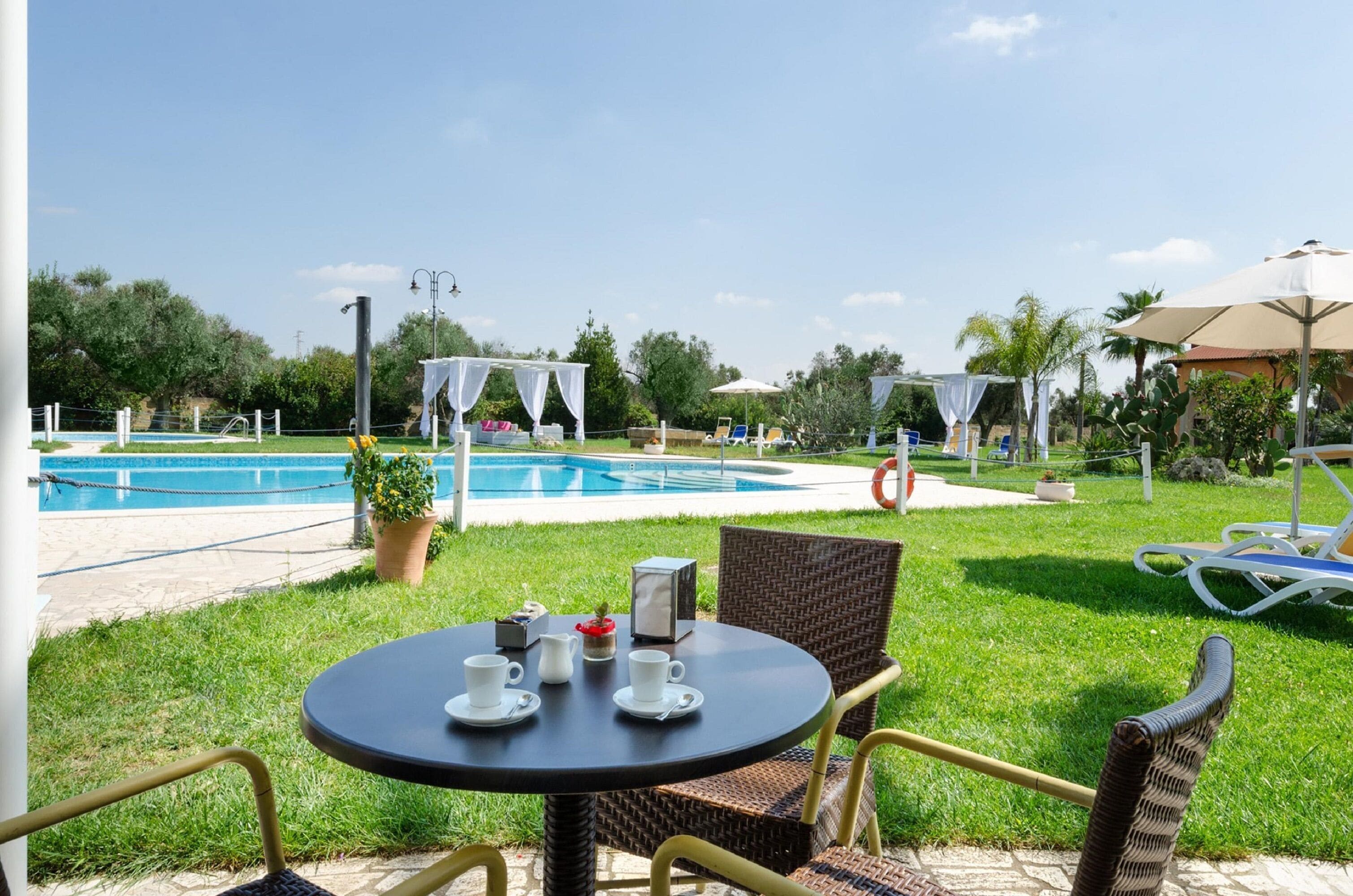 2 outdoor pools, pool umbrellas, pool loungers