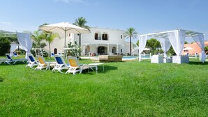A resort with a pool area, white canopies, and lounge chairs. - Masseria la Baronessa Resort (Tuglie)