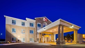 A hotel with a stone facade, a covered entrance, and a sign indicating it is part of the Best Western PLUS chain. - Best Western Plus Montezuma Inn & Suites (Las Vegas)