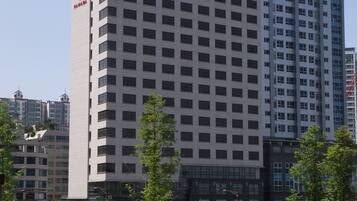 A multi-story building with a prominent 'RAMADA' sign on the side.