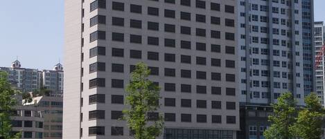 A multi-story building with a prominent 'RAMADA' sign on the side.