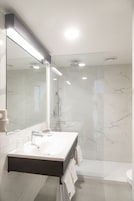 Shower, rainfall showerhead, designer toiletries, hair dryer