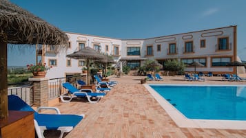 Outdoor pool, pool umbrellas, sun loungers