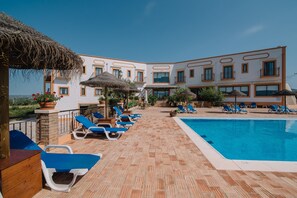 Outdoor pool, pool umbrellas, pool loungers
