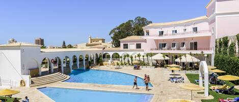 2 outdoor pools, open 9:00 AM to 8:00 PM, pool umbrellas, pool loungers