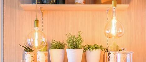 A kitchen counter with various food items and kitchenware.