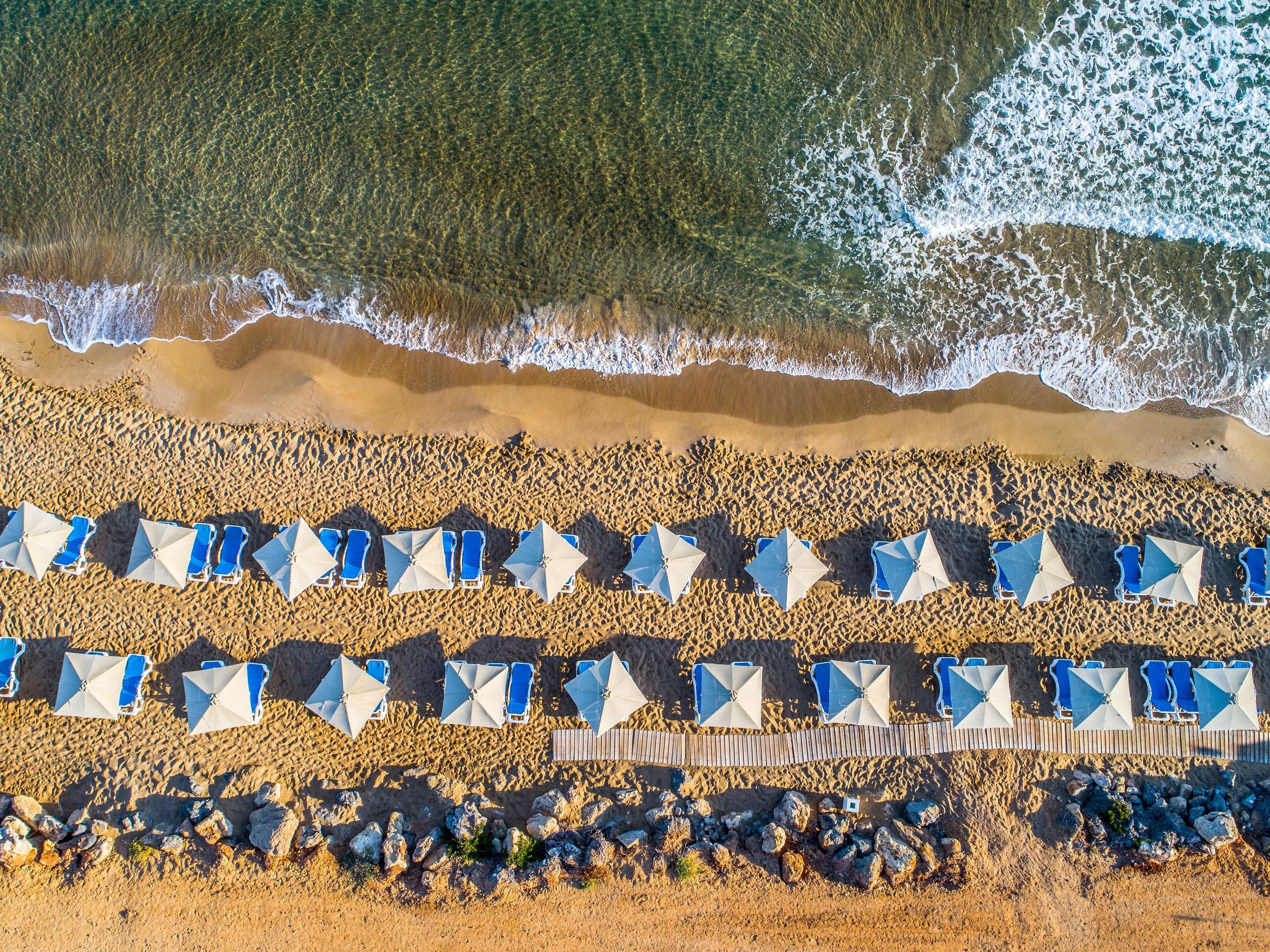 On the beach, sun-loungers, beach umbrellas, beach towels